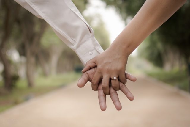 Holding Hands of Boy and Girl